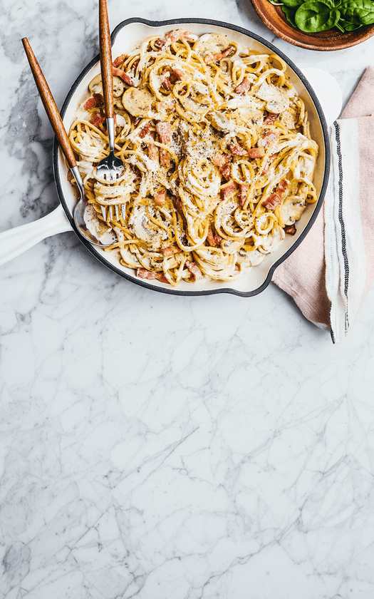 Pasta dish in a pan on a marble surface