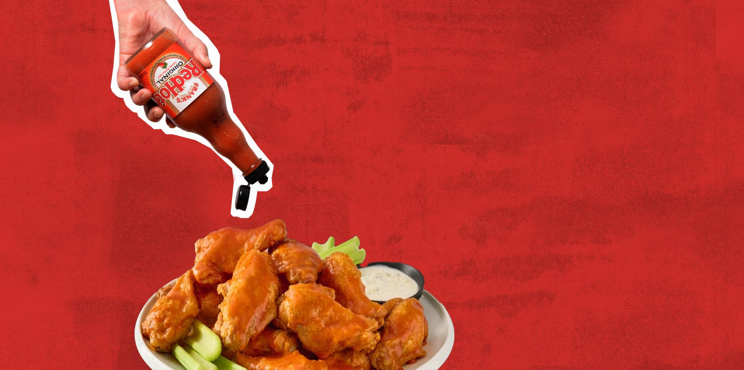 Franks redhot sauce pouring on wings