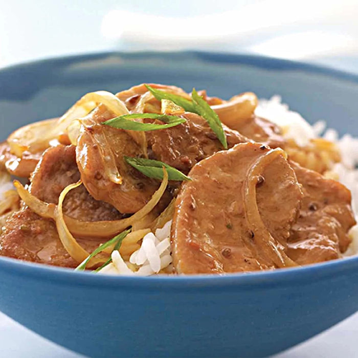 A close-up of a savory meat and onion dish served over rice in a blue bowl, a delicious meal idea that can be created using the Barrel product.